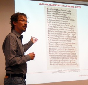 Sándor Chardonnens exhibits the list of 'Cats in Alphabetical Dream Books' in his paper for the session on 'Predicting the Past' at the 2015 International Congress on Medieval Studies. Photography © Mildred Budny