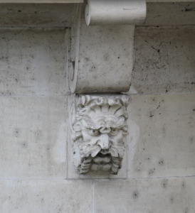 Frowning Corbel Head on Le Pont Neuf, Paris. Photograpny by Ilya V. Sverdlov
