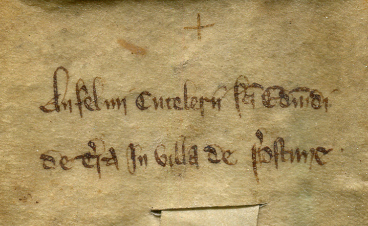 Docketing inscription on the dorse of a deed of sale of of land at Preston, near Ipswich, circa 1200, cropped to the left-hand half of the column of its text. Reproduced by permission.