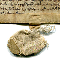 Cloth bag, now empty, for the original seal to authenticate the document, which remains intact, for a transaction of about the mid 13th-century at Preston, near Ipswich, Suffolk, UK. Photograph reproduced by permission.