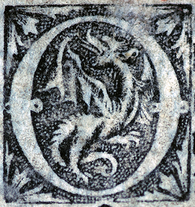 Printed Initial O with winged dragon. Photograph © Mildred Budny