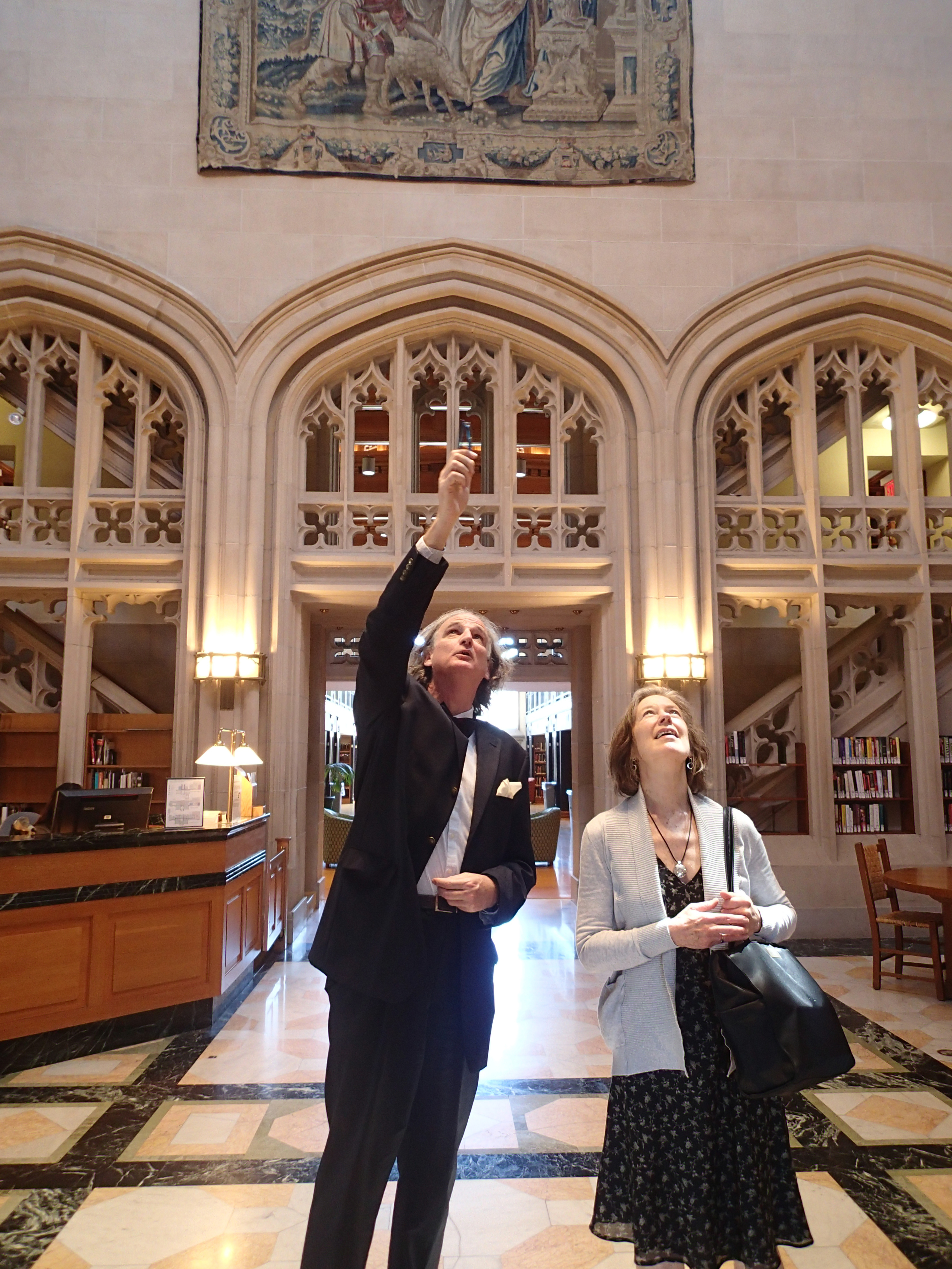 Thomas Hill explains the iconography of the cycle of tapestries adorning the entrance hall to the Vassar College Library. Photography © Mildred Budny