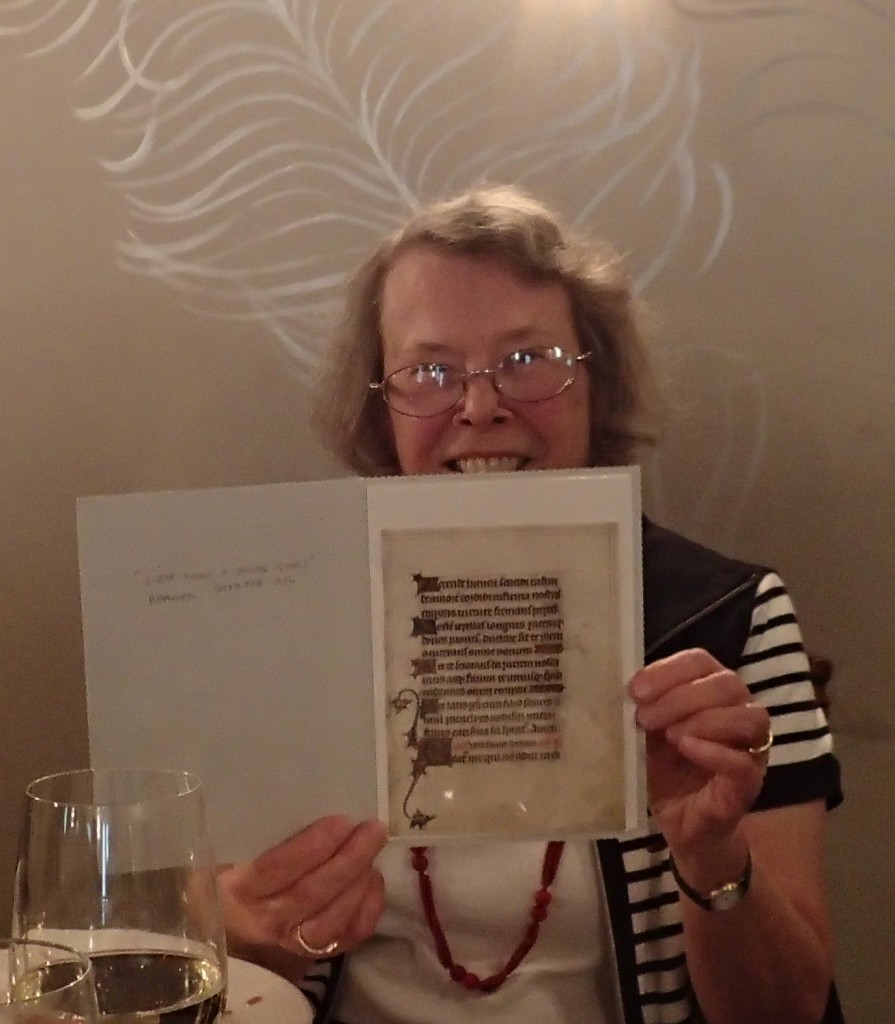Adelaide Bennett holds up the newly presented leaf from a dismembered Book of Hours which she saw, while still whole, years ago.