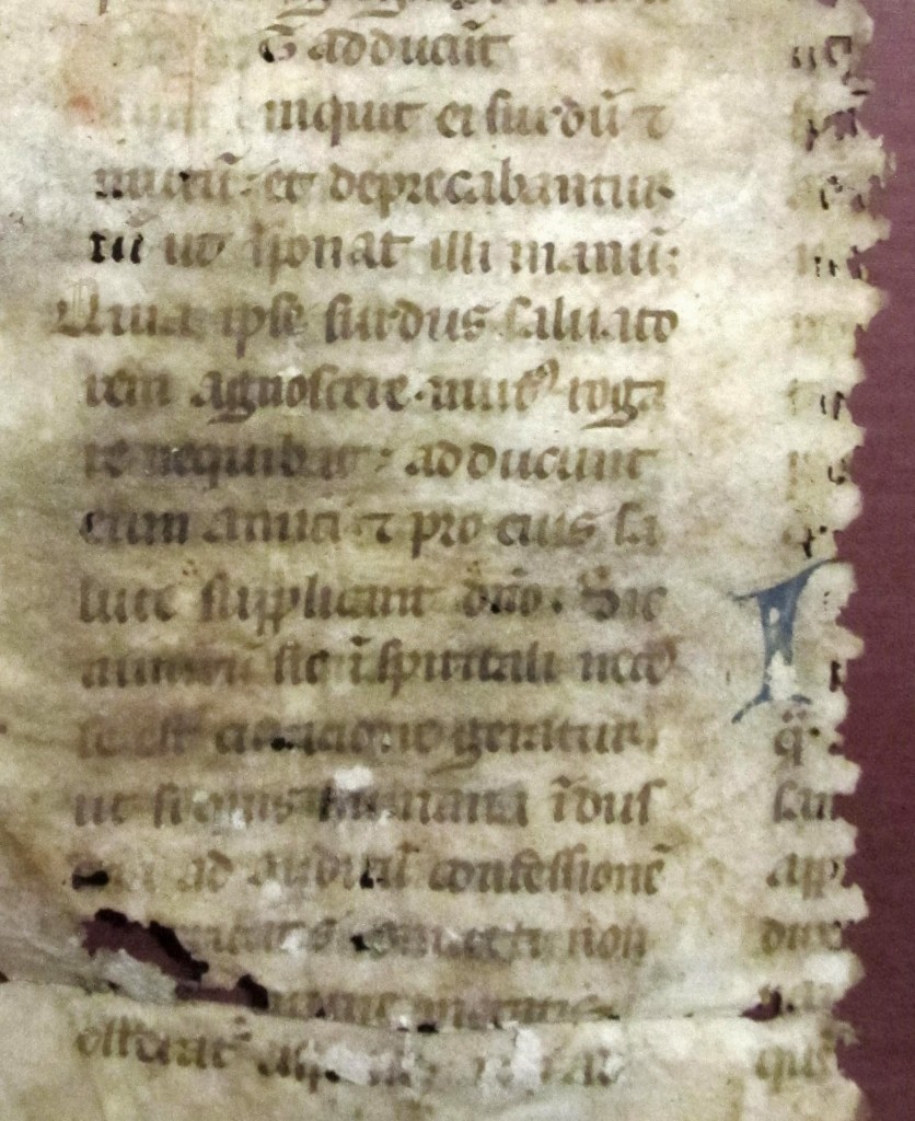 Verso, Lower Right, with parts of the left-hand edge of the mostly-missing column of text and the traces of a blue-green initial.