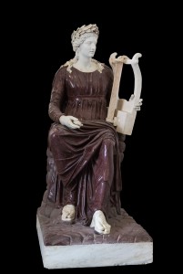 Apollo Seated with Lyre. Porphyry and marble, 2nd century CE. Farnese Collection, Museo Archeologico Nazionale. Photograph by Jebulon via Creative Commons.