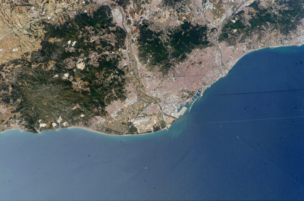 Astronaut photo of Barcelona, Catalonia, Spain (3 June 2004). Via Earth Observations Laboratory, Johnson Space Center. NASA, public domain.
