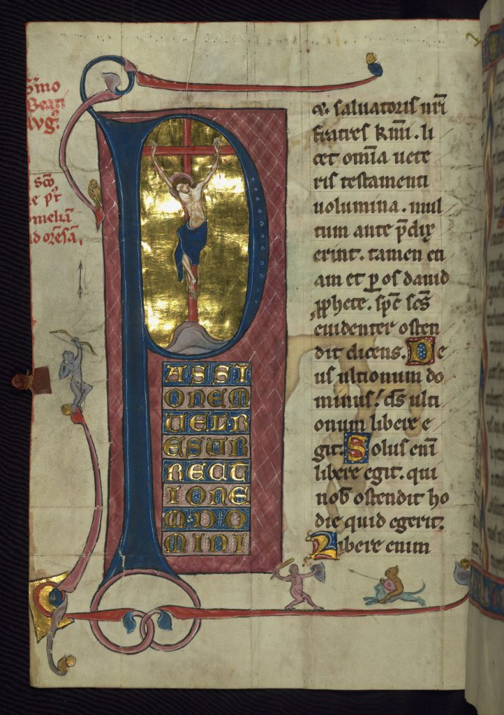 Baltimore, Walters Art Museum, MS. W.148, folio 33v. Opening of Sermon of St. Augustine on Easter, with Crucifixion illustration and border imagery. 14th-century German Homiliary. Image via Creative Commons.