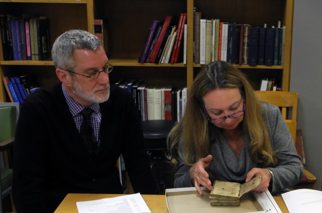 Inspecting the despoiled Book of Hours at our 'Show & Tell' Seminar on Manuscripts & Their Photographs on 9 December 2014