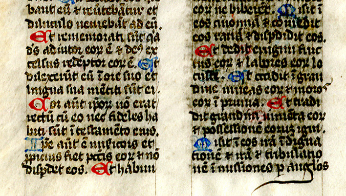 Folio 6 verso bottom, with part of the Psalm text in double columns and alternately colored initials in blue and red. Reproduced by permission.