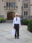 Thomas E. Hill stands at the entrance to the Vassar College Library. Photography by Mildred Budny