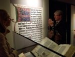 At the Exhibition of "Gutenberg and After" at Princeton University in 2019, the Co-Curator Eric White stands before the Scheide Gutenberg Bible displayed at the opening of the Book of I Kings.
