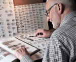 Donncha MacGabhann at work on his close study of letter forms in the Book of Kells. Photograph via his publisher, Sidestone Press (Leiden 2022)